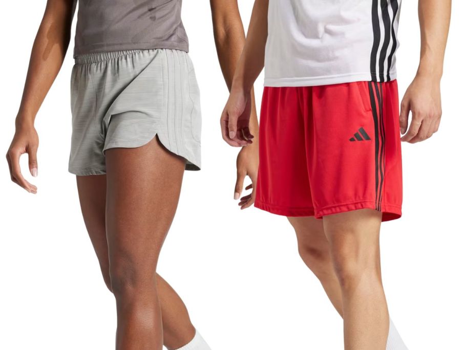 2 people wearing adidas shorts 
