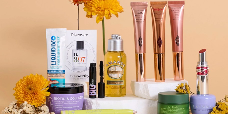 makeup products on display with flowers 