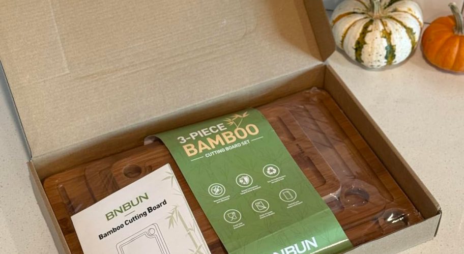 box of bamboo cutting boards in box on counter with pumpkins