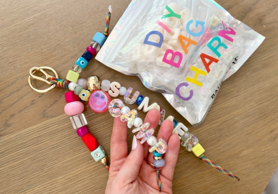 hand holding a large charm keychain