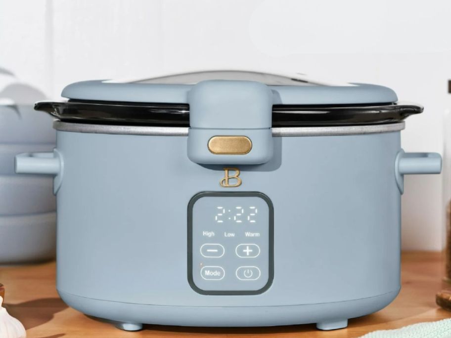 blue digital slow cooker with locked lid