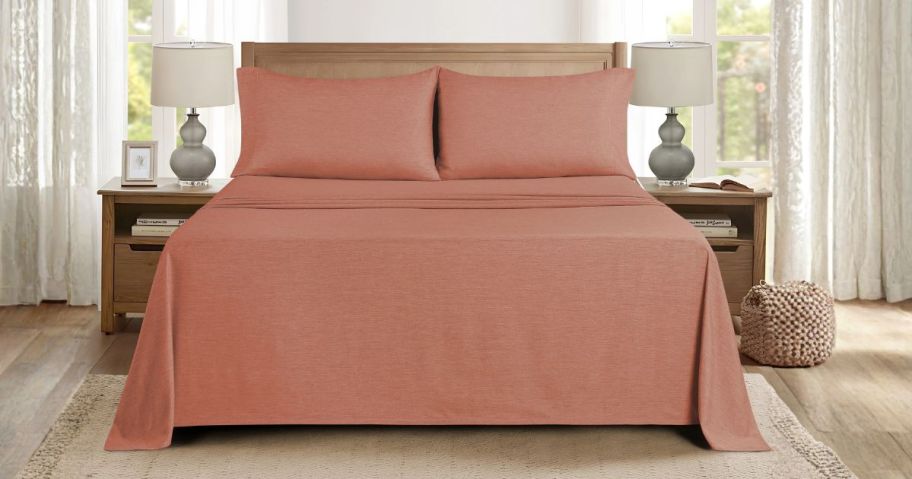 terracotta bedding set on bed in bedroom