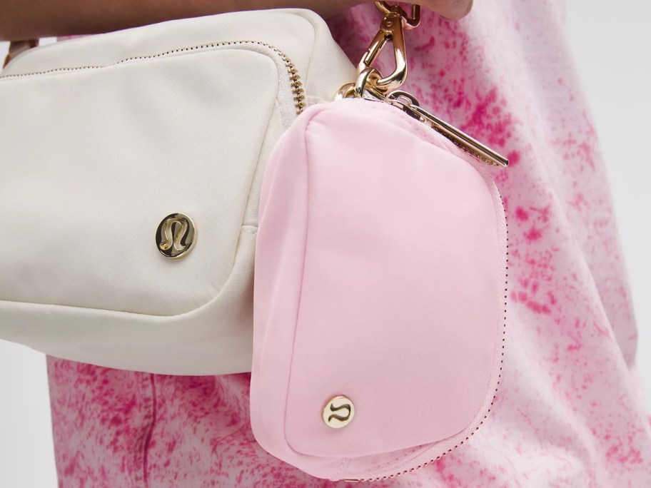 pink nano belt bag attached to a shoulder bag