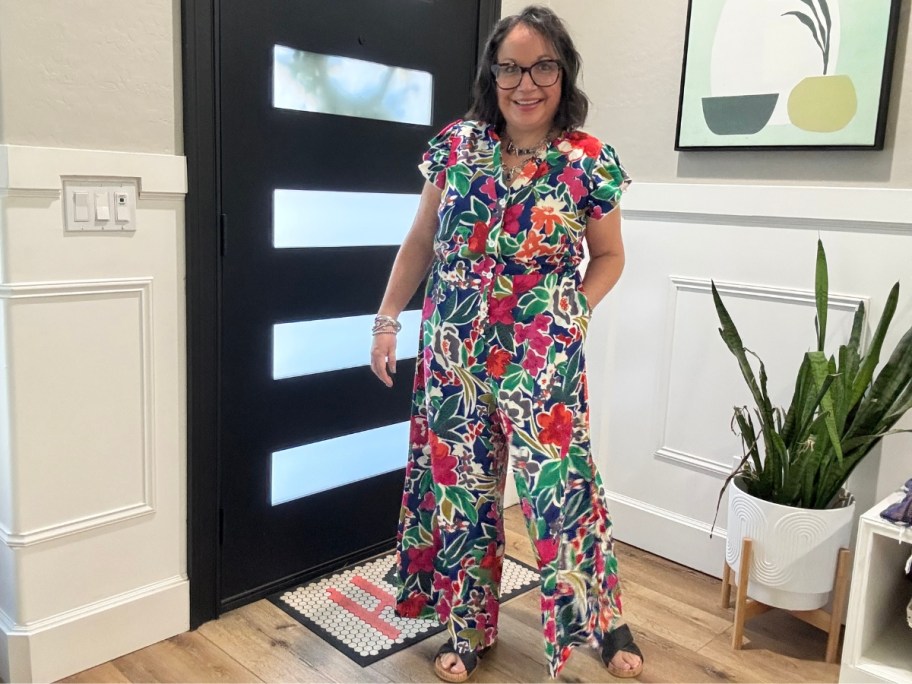 woman wearing a floral jumpsuit
