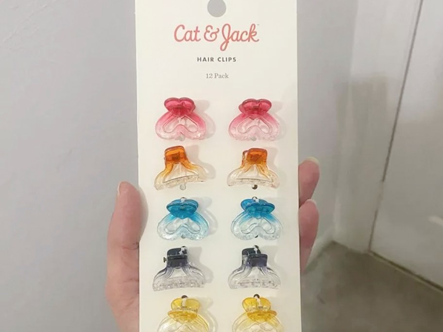 hand holding cat jack hairclips 