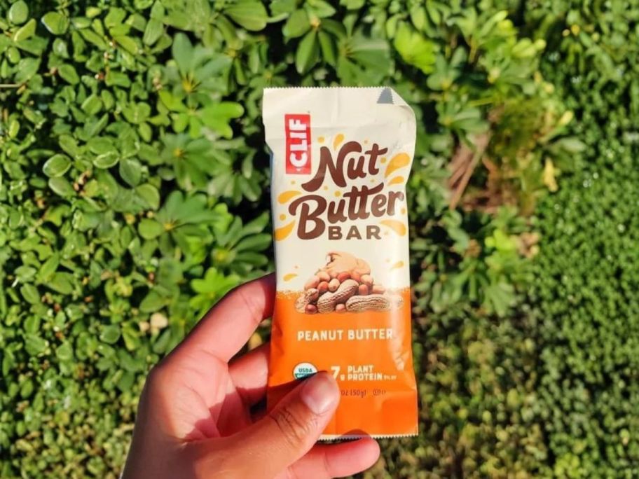 hand holding clif nut butter bar