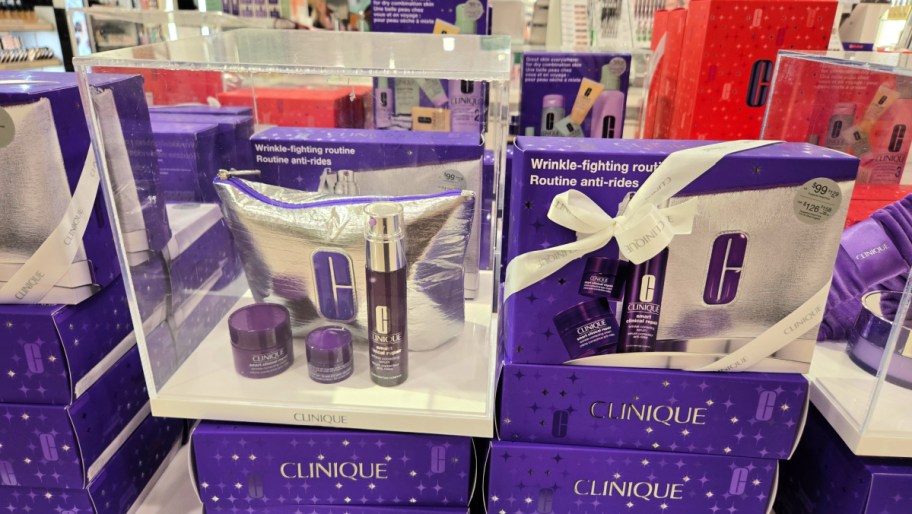 clinique gift set on display in a store next to the contents