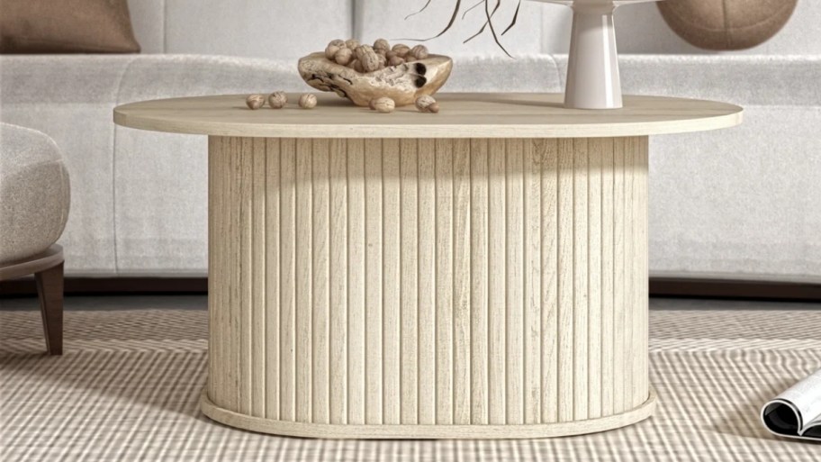 oval wooden coffee table in a light wood finish