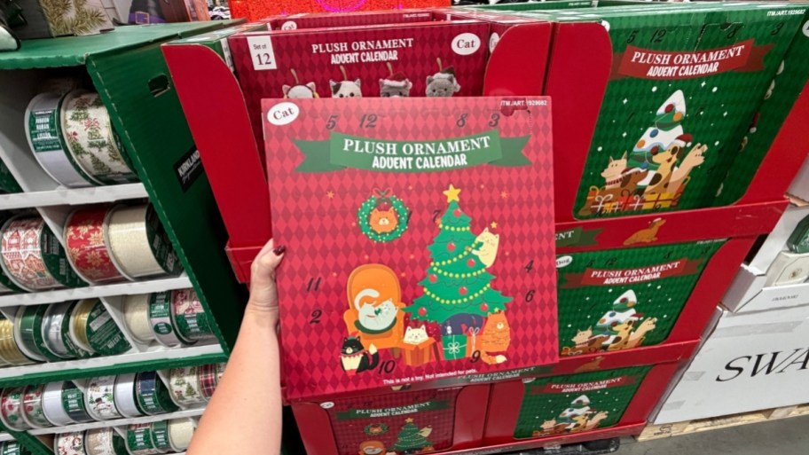 womans hand holding a plush ornament advent calendar