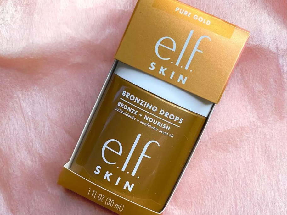 bronzing drops on pink blanket