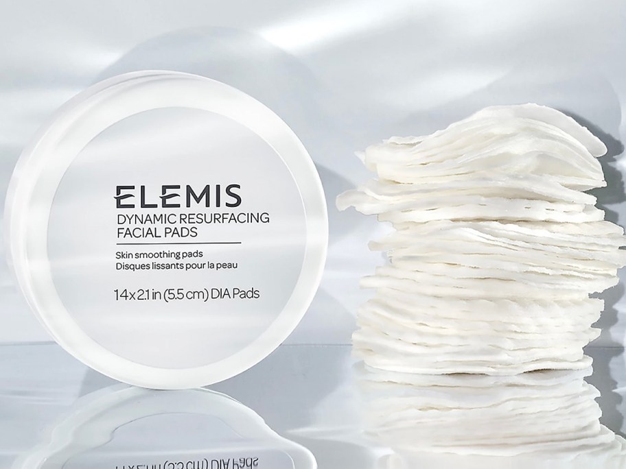elemis facial pads jar with pads laying next to it 