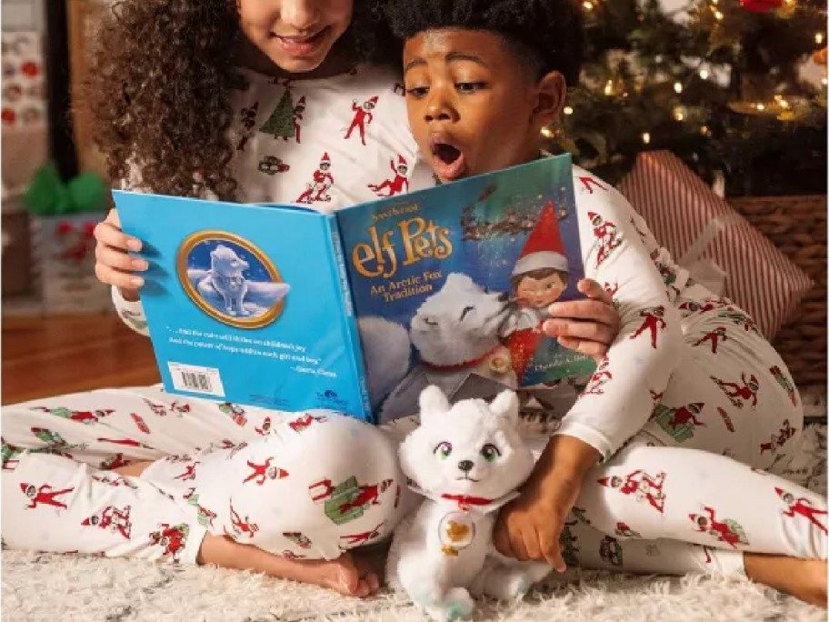 Kids playing with the Elf on the Shelf Arctic Fox set.