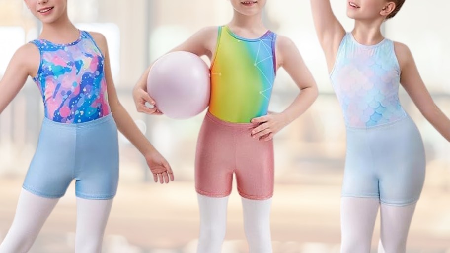 three little girls in unitard and shorts dance outfits