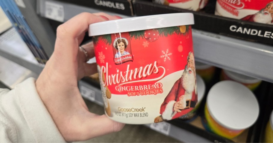 hand holding a Little Debbie Christmas Tree Cakes scented Goose Creek candle