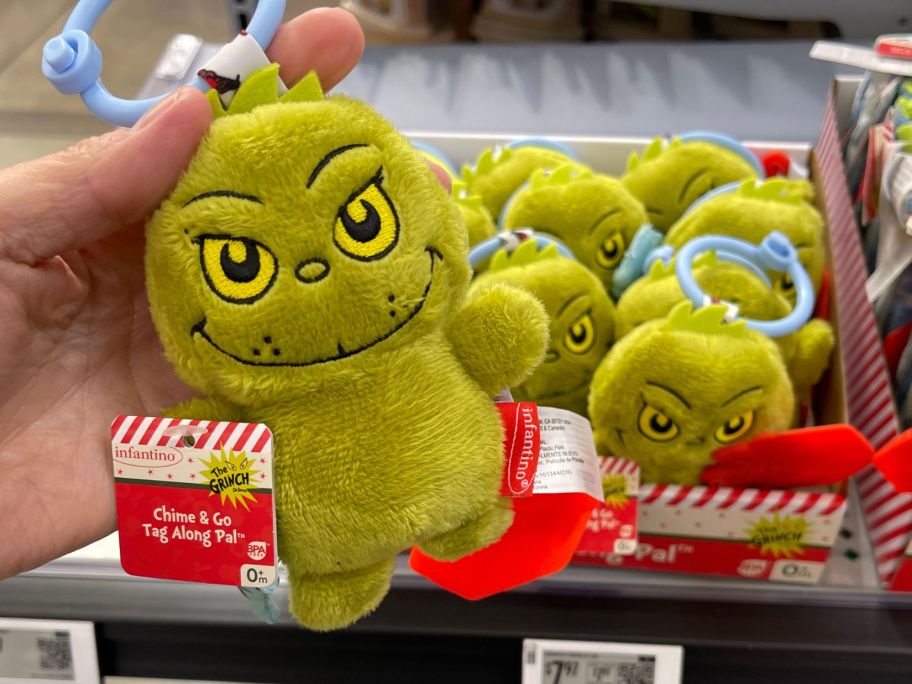 Infantino Grinch Chime & Go Tag Along Pal in hand in store