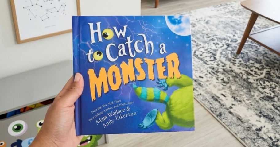 hand holding a halloween book