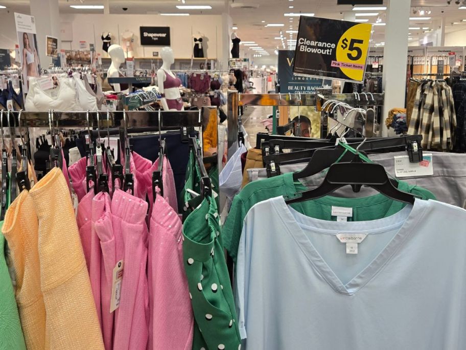 women's clearance clothing in store with $5 sign in the background