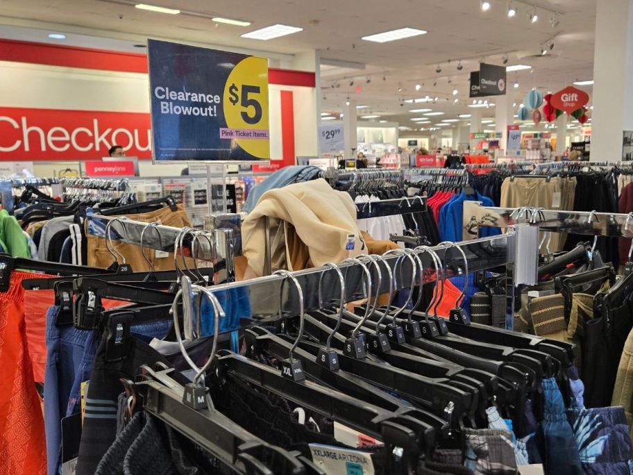 men's clearance clothing in store with $5 sign by it