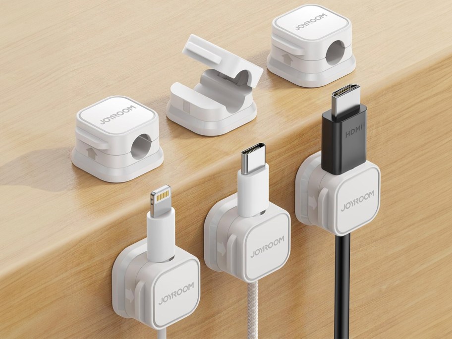 6 white clips on table with 3 holding cables