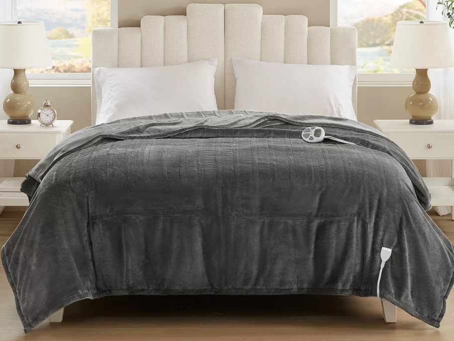 gray blanket on bed 
