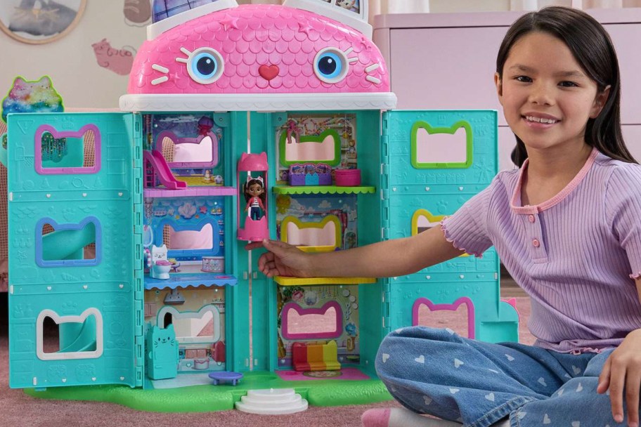 girl playing with gabbys dollhouse life size house