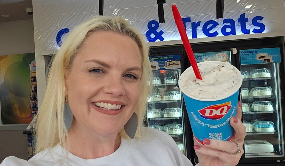 woman holding a blizzard and shake from dairy queen