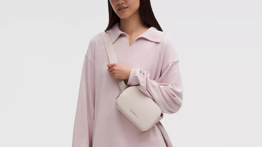 woman with a white belt bag