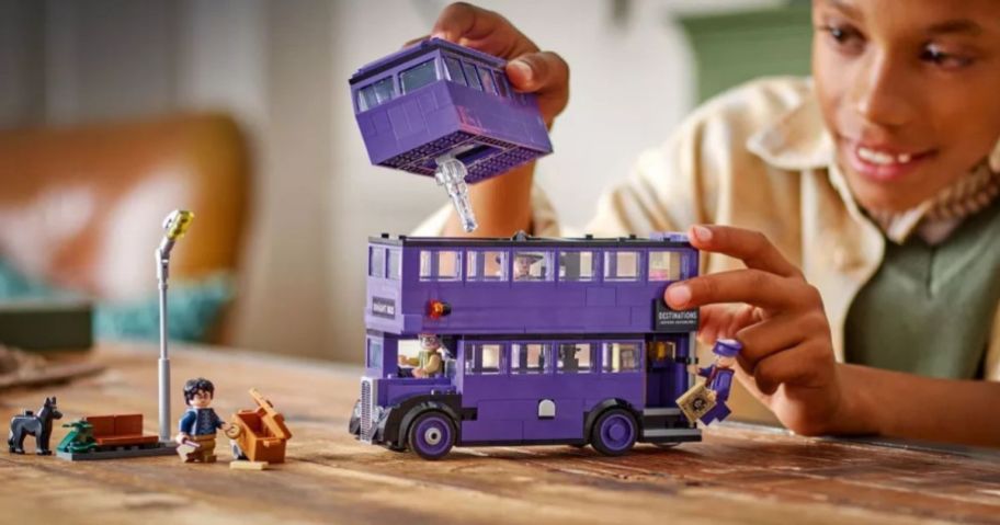 kid playing with LEGO Harry Potter Knight Bus Adventure
