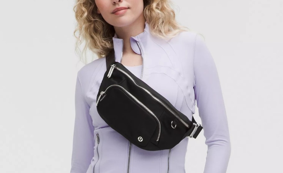 woman with a black belt bag