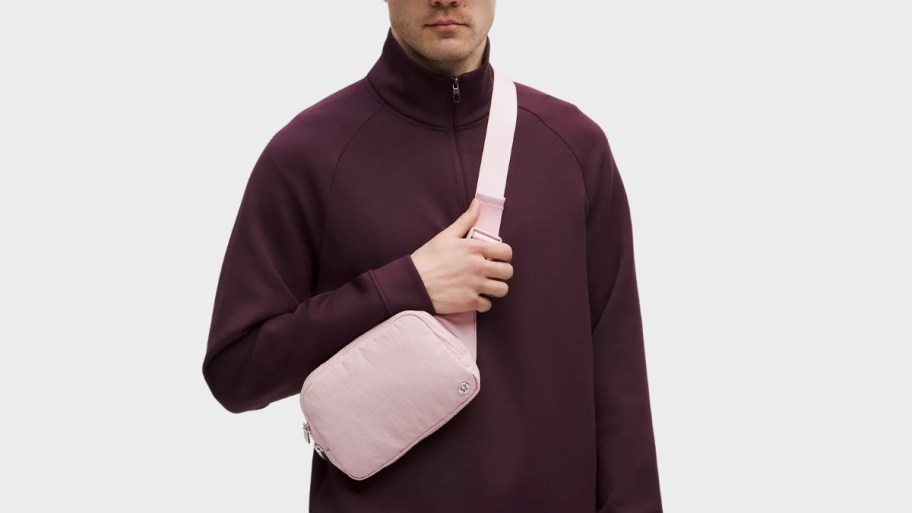 man with a pink belt bag
