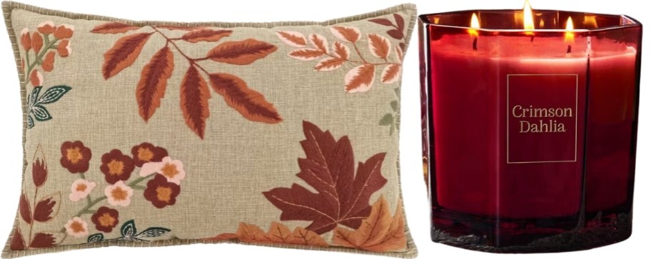 a fall themed throw pillo and 3 wick candle