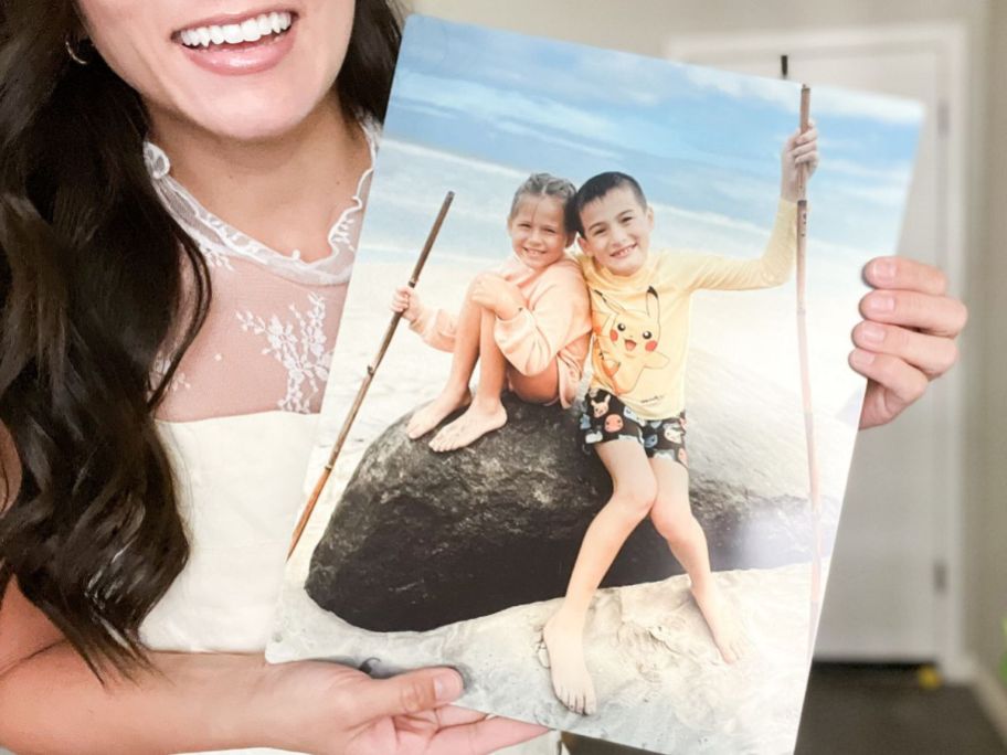woman holding walgreens metal print