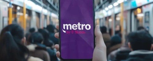 hand holding phone with tmobile metro ad on it