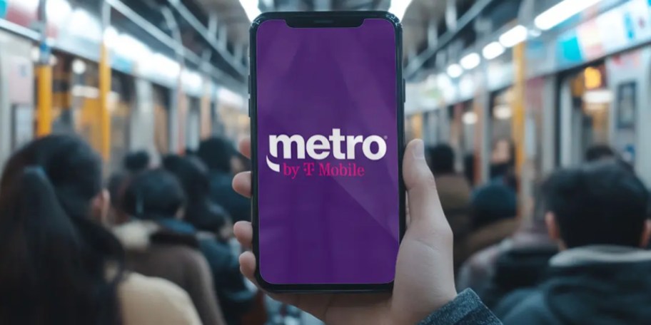 hand holding phone with tmobile metro ad on it