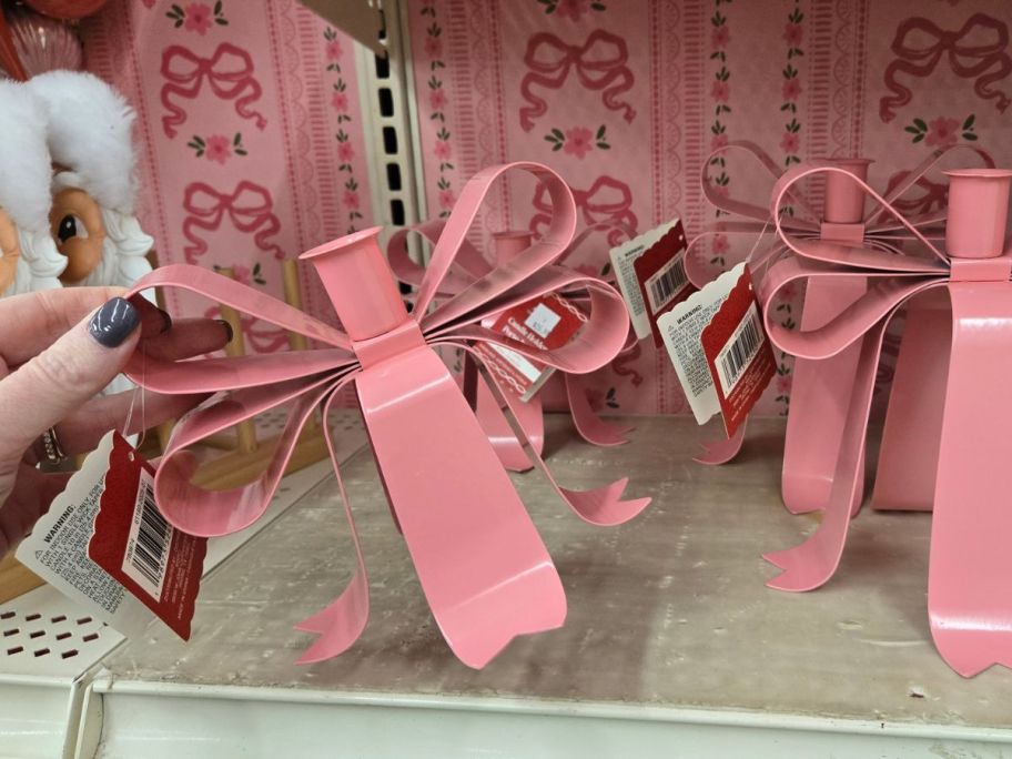 Bow Taper Candle Holder in hand in store