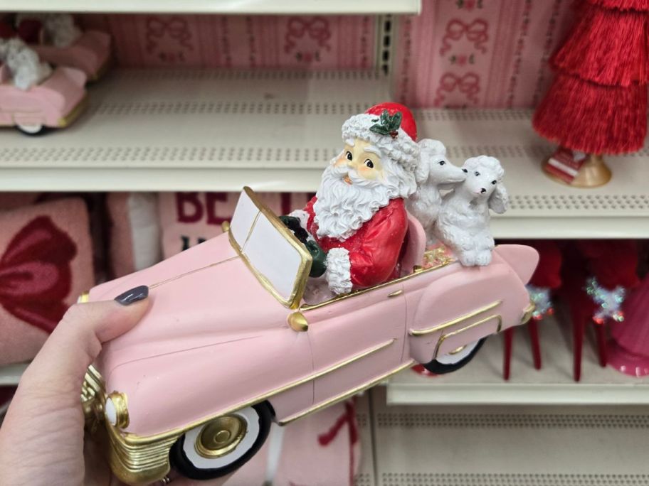 Santa & Poodles in Pink Car Tabletop Décor in hand in store