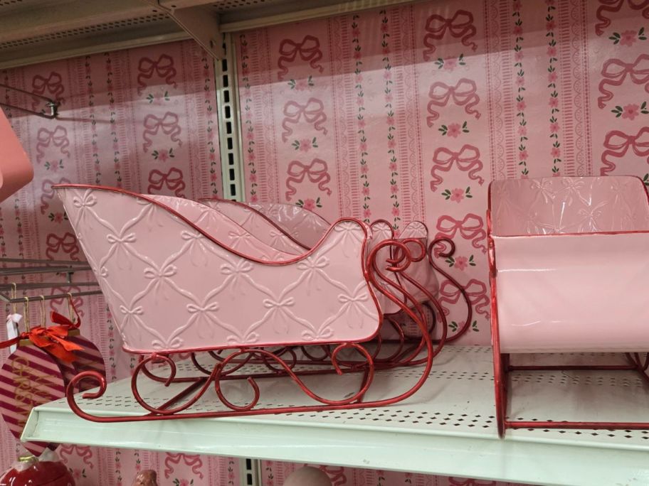 Pink Bows Sleigh Tabletop Décor on shelf in store