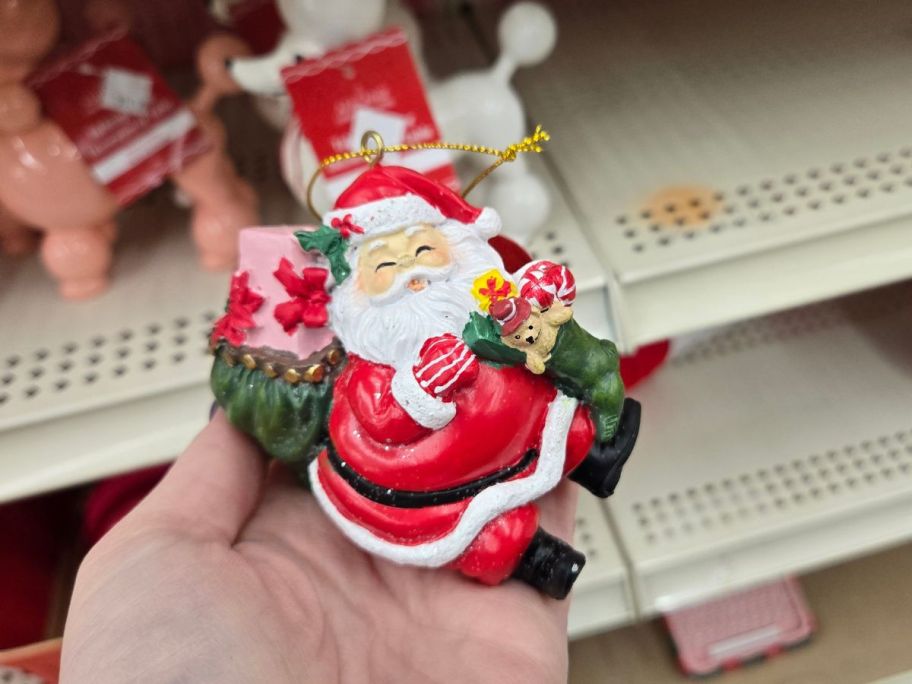 Happy Santa Ornament in hand in store