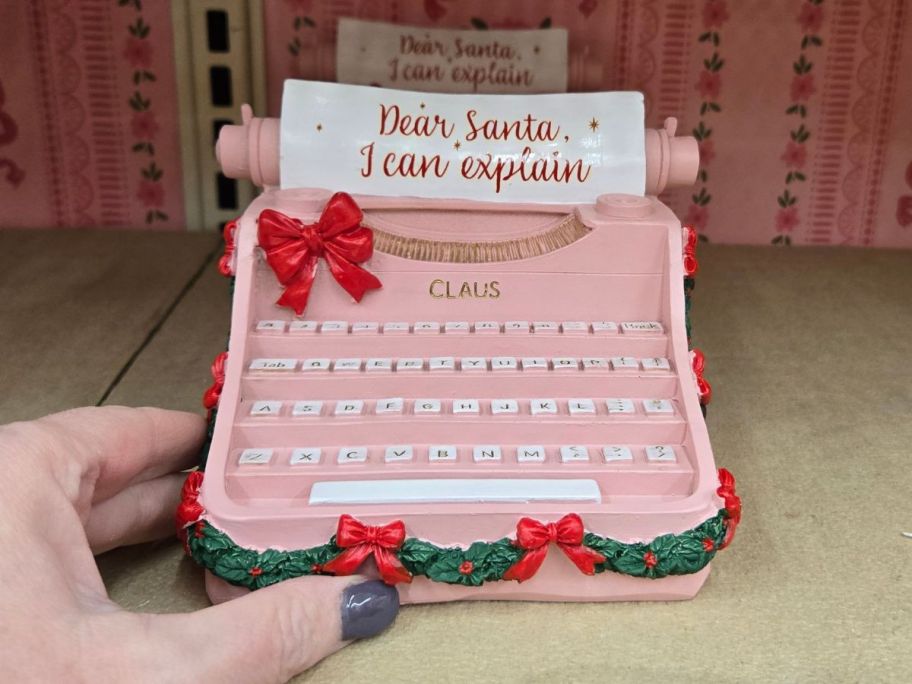 Pink Dear Santa Typewriter Tabletop Décor on shelf in store