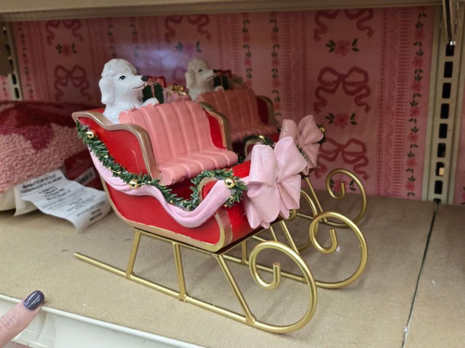 Sleigh w/ Poodle & Gifts Tabletop Décor on shelf in store
