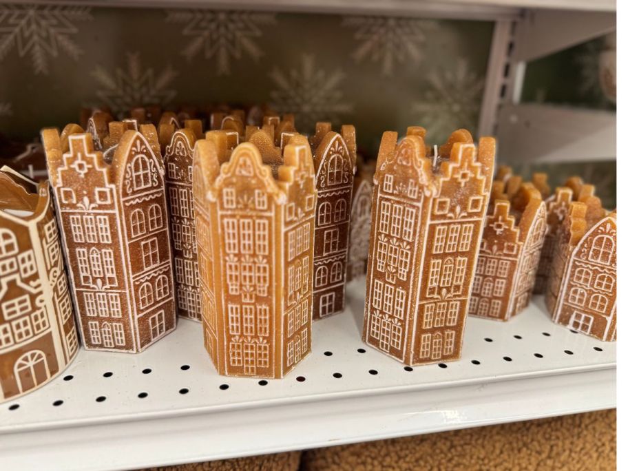 Gingerbread Village Unscented Candles on shelf in store
