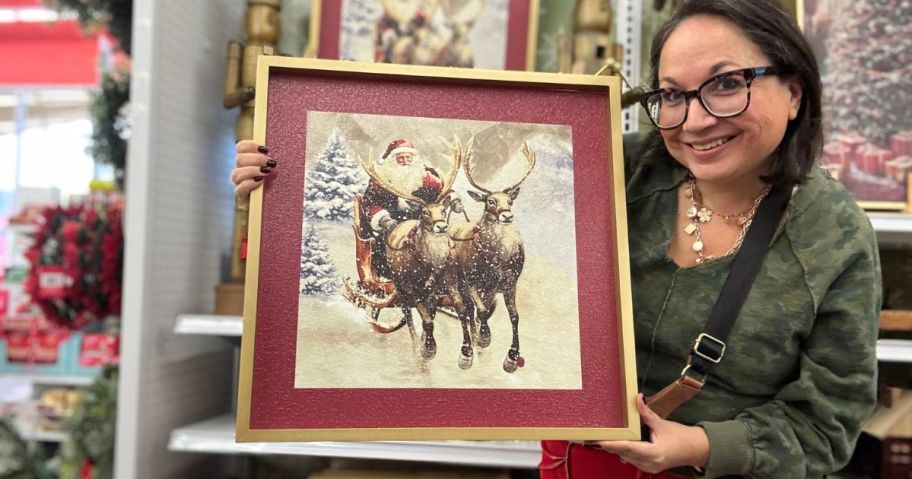 woman holding christmas picture in store