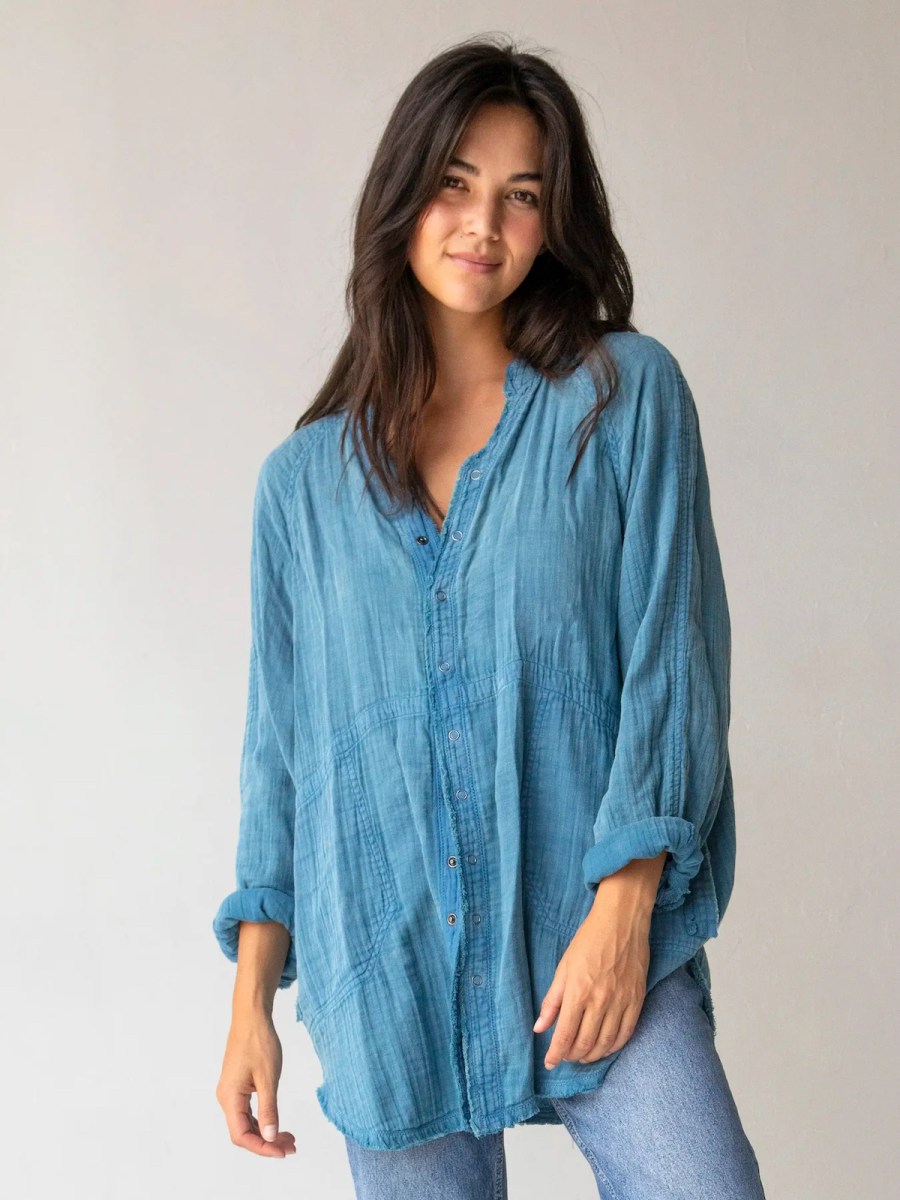 woman modeling blue button down cotton shirt