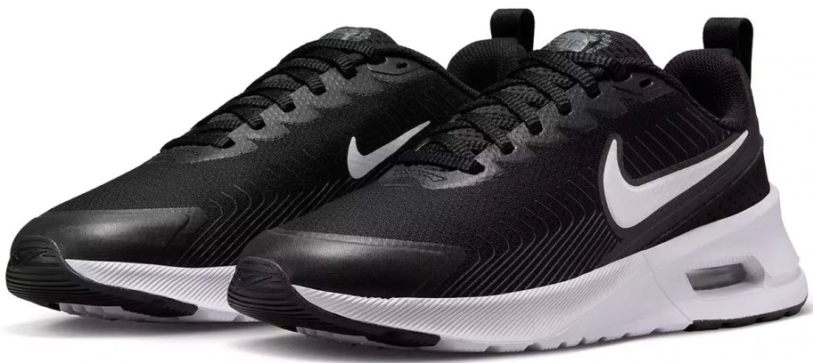 pair of black and white nike shoes
