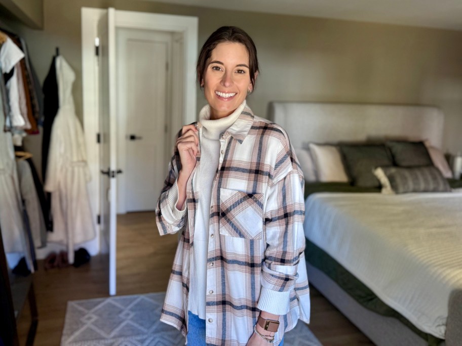 woman wearing flannel shirt in bedroom