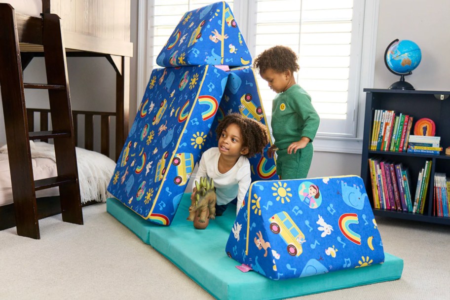 two boys in triangle pillow fort