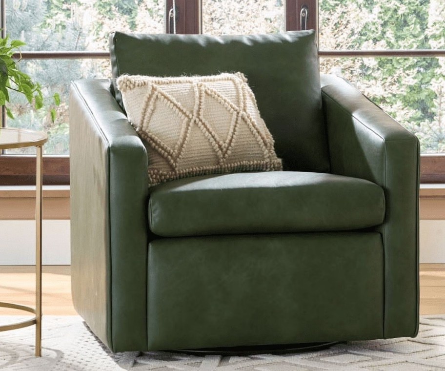 a green faux leather swivel chair