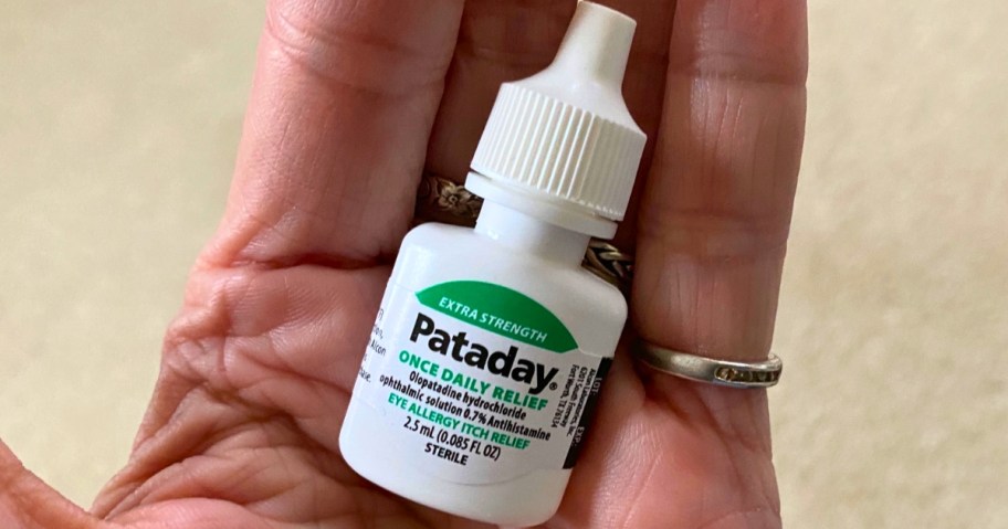 hand holding a bottle of Pataday eye itch relief drops