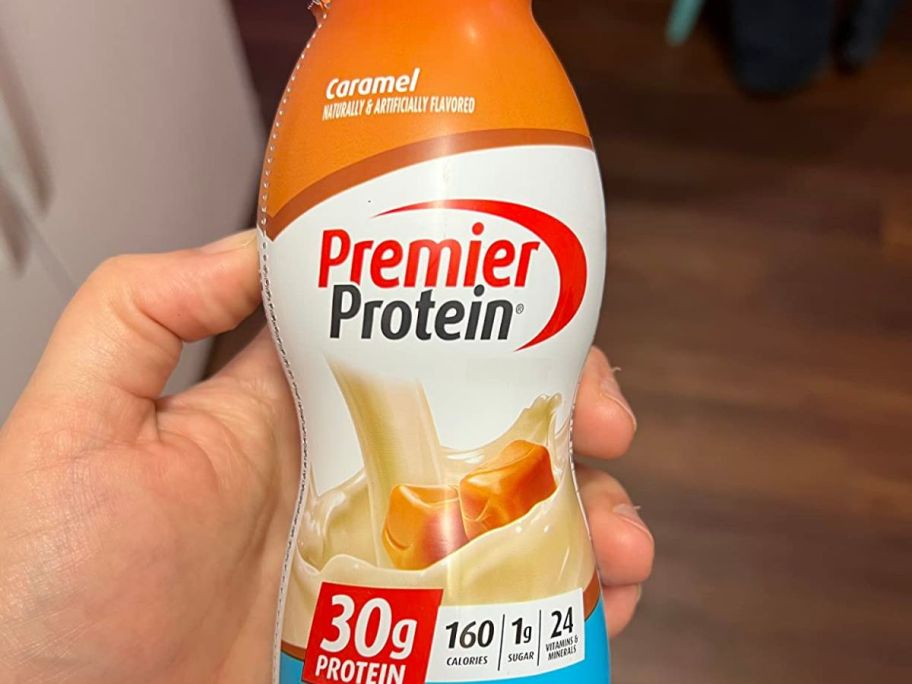 hand holding premier protein caramel