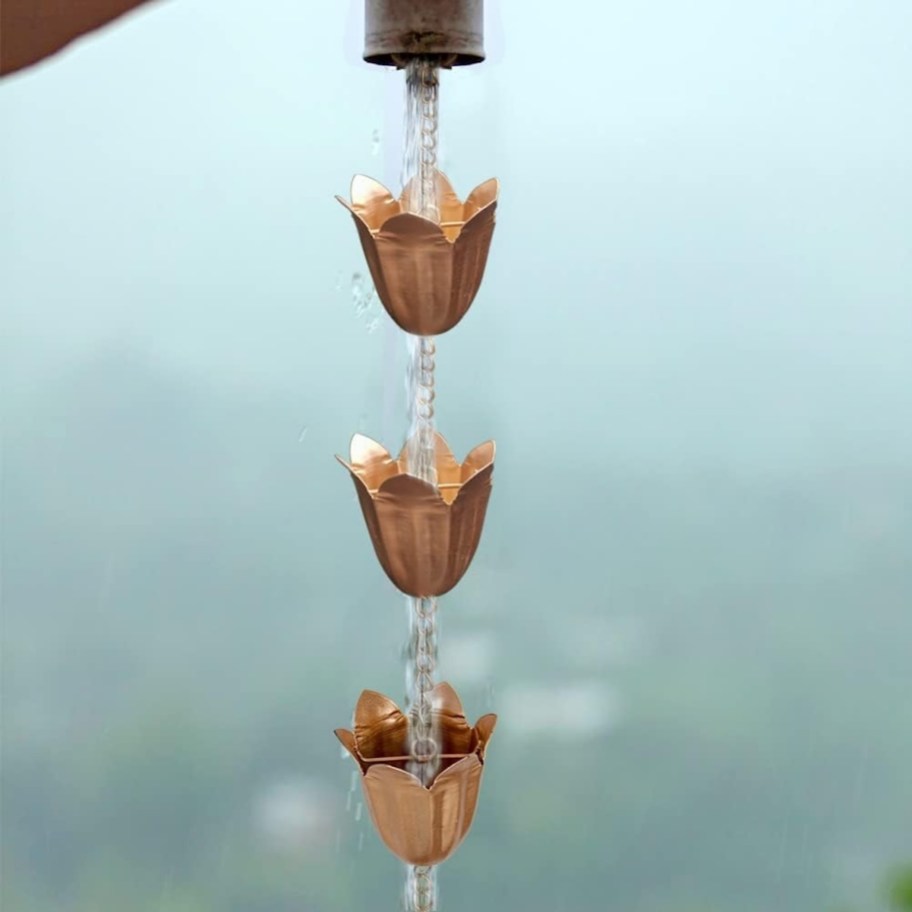 close up of rain chain brass tulip shaped